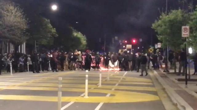 Protestors burn American flag during Durham protest 