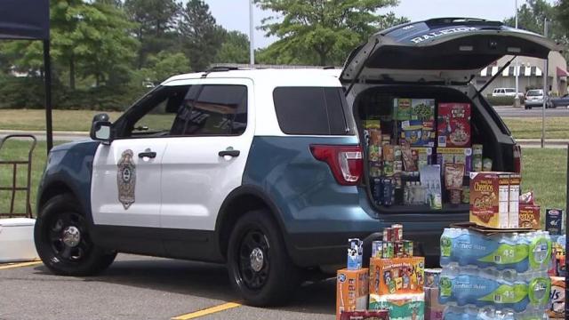 Raleigh police "fill a cruiser" with donations for families in need