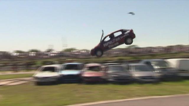 British car jumping back with a bang