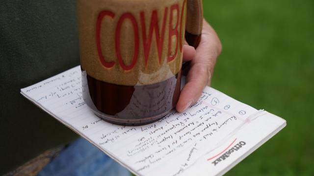 Cowboy holding Cowboy coffe cup, notes on prepping