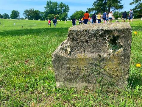 A crowd of around 50 people gathered for a walking tour of the rolling green hills of Mt. Hope Cemetery, one of Raleigh's earliest municipal African American cemeteries. 