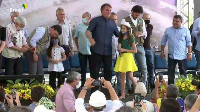 Brazil's president asks young girl to take off mask