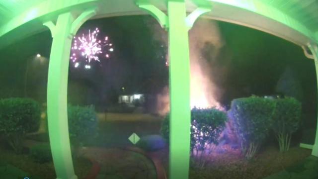 Errant fireworks blast leads to bush fire in front of WRAL reporter's home