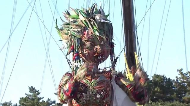 Japanese artists reveal giant Olympic puppet to mixed reaction 