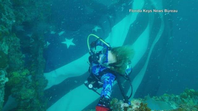 Divers unveil giant American flag underwater at Florida Keys sanctuary