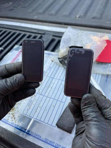Officials found three cell phones in a package dropped off at the local high school