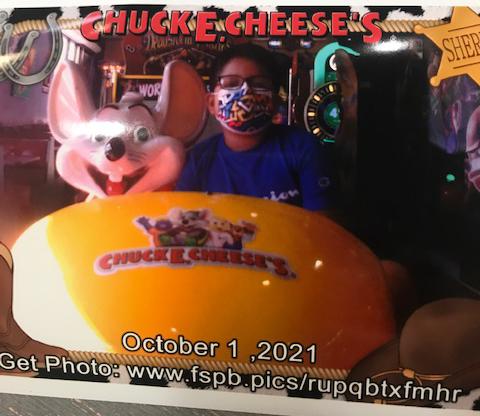  7-year-old Ray Sanchez at Chuck E. Cheese's. He always wears his mask, his mom said. 