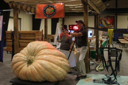 Chris Rodebaugh of Lewisburg, WV set a site record with a 1,965.5-pound pumpkin. Chris Rodebaugh of Lewisburg, WV set a site record with a 1,965.5-pound pumpkin. Andrew Vial of Liberty also set a site record for his 341-pound watermelon. (Photo from the N.C. State Fair). 