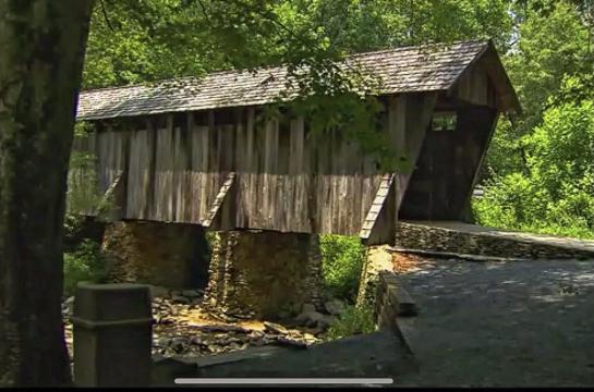 Pisgah covered bridge was built in 1910, but was washed away in 2003 and rebuilt. It's one of NC's oldest remaining covered bridges.
