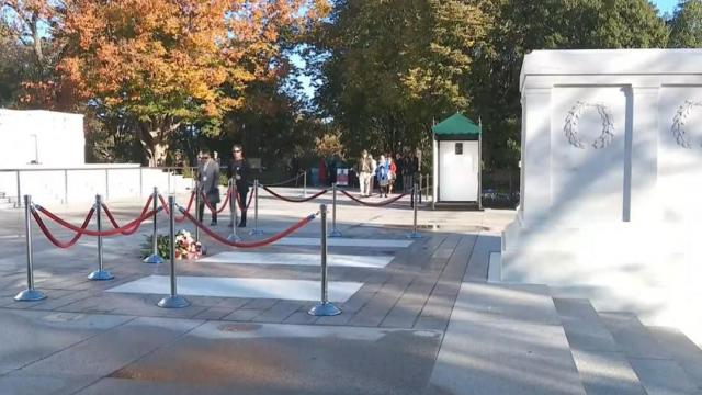 People lay flowers at Tomb of the Unknown Soldier in commemoration of 100th anniversary