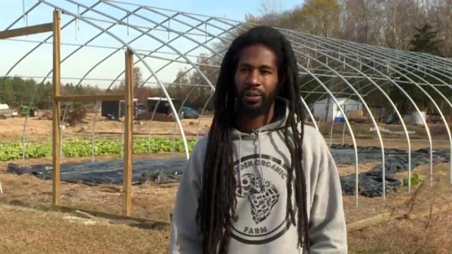 Black farmer planting seeds to bring equity to agriculture