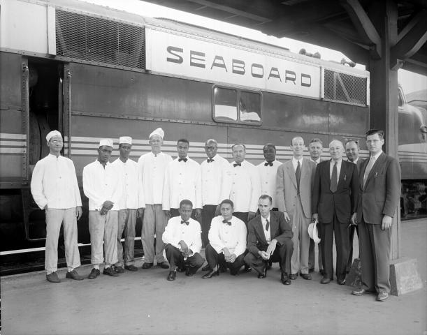 Seaboard employees pose in front of a Seaboard train. (Image courtesy of the State Archives of North Carolina)