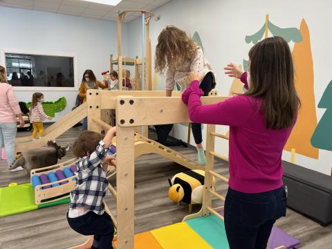 The interaction at an indoor play place is rewarding for parents and children.