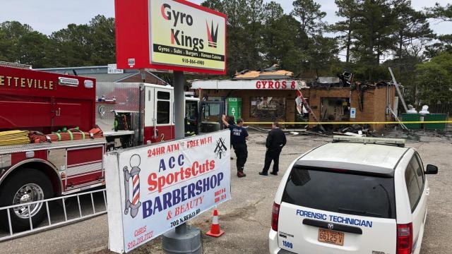 Authorities investigate fire that tore through two Fayetteville businesses as possible arson
