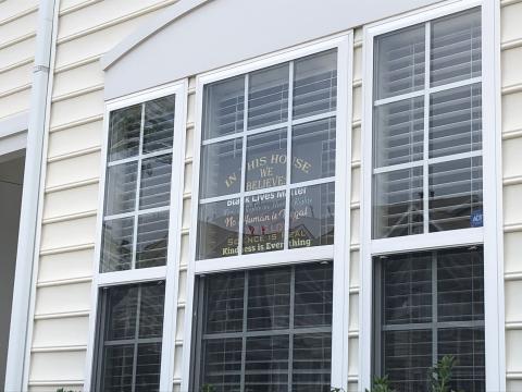 Raleigh family claims HOA is discriminating against them because of this sign in their window 