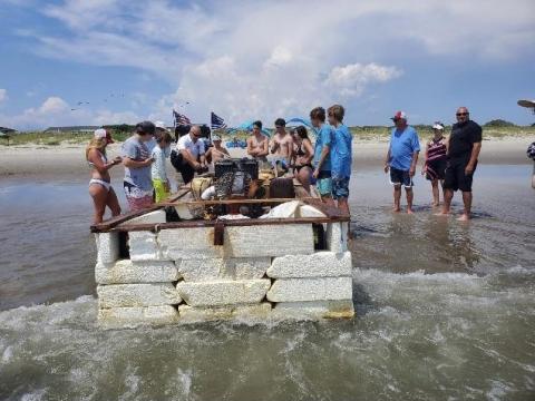Makeshift boat washes ashore at Caswell Beach 