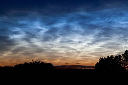 Noctilucent clouds appeared in the sky above Edmonton, Alberta, in Canada on July 2, 2011.
Credits: NASA/Dave Hughes
