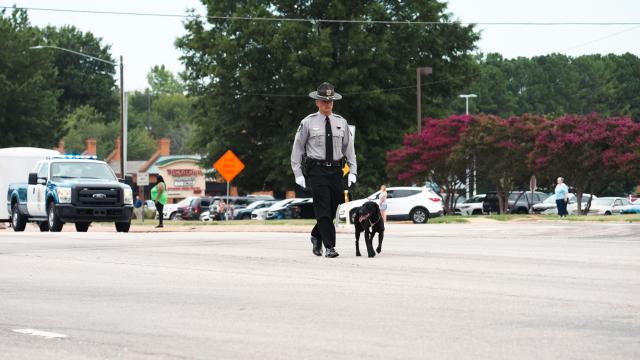 Deputy Ned Byrd's K-9, Sasha, leads procession to his funeral