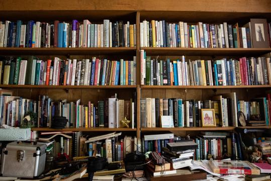Ruth Moose keeps a healthy collection of books across various shelves in her house.