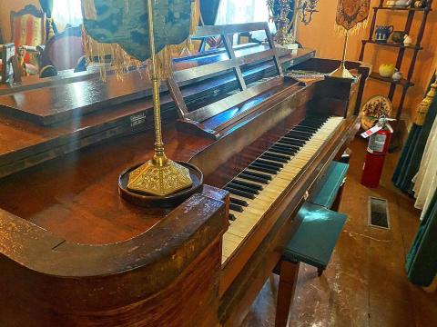 This piano in the Mordecai House is the center of many haunted legends. People claim to hear it play by itself when they are alone in the house at night. Others say a grey mist floats over the keyboards -- similar to the grey mist seen on the stairwell.