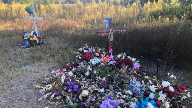 A memorial of wreaths and crosses at the site where Lyric Woods and Devin Clark were found dead in Orange County in September.