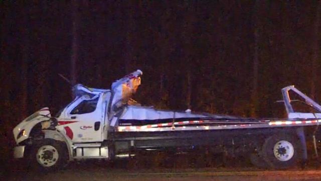 Mail truck overturns on I-95, spilling packages across roadway