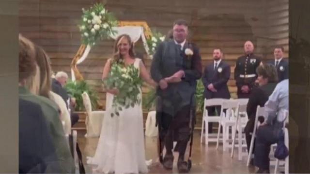 Exoskeleton technology allows injured Marine veteran to walk bride down aisle