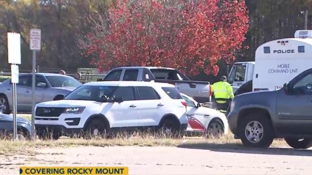 Two found dead inside car, 2 young children in backseat unharmed