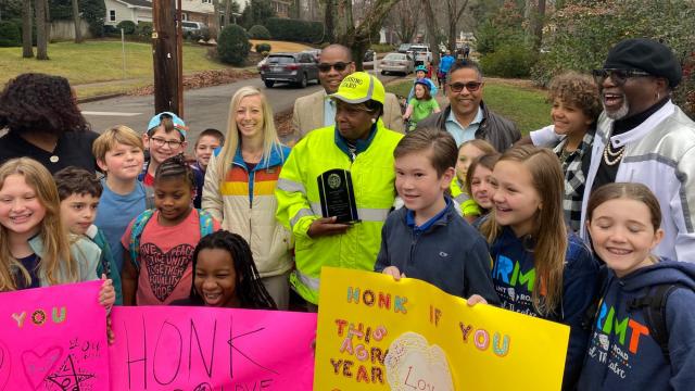 Crossing guard honored for devotion to students, families