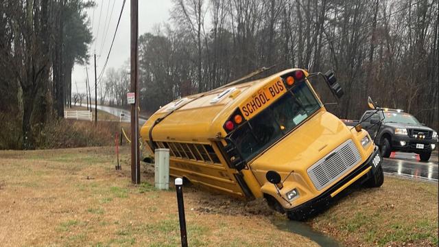 Charter school bus overturns in ditch in Lee County 