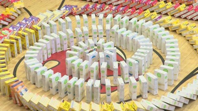 Students set world record with thousands of cereal boxes through domino effect