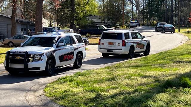 Cary firefighters find human remains in trash fire; police find man shot on property