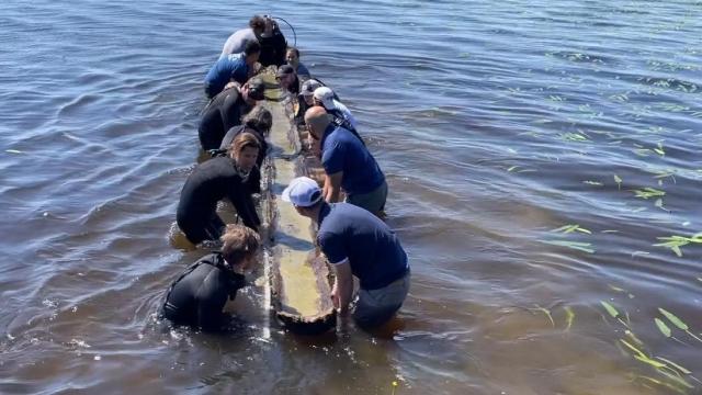 Ancient Native American canoe brought to surface from beneath Lake Waccamaw
