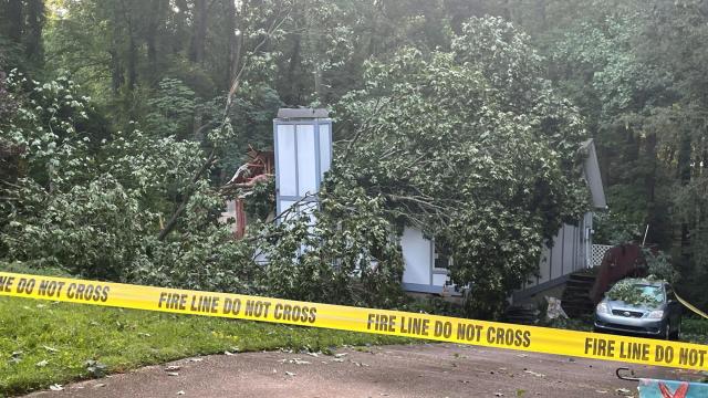 Massive tree falls on Cary home with 2 people inside 