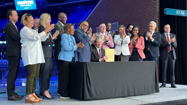 Gov. Roy Cooper signed HB 347 into law on June 14, 2023 at the Spectrum Center in Charlotte. The legislation allows mobile sports betting in North Carolina. It also allows in-person sports betting at eight sports venues across the state. Cooper was joined by state lawmakers and officials from several professional teams and venues.