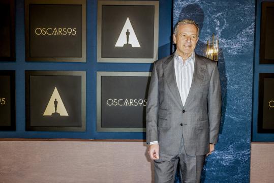 FILE — Disney CEO Robert Iger attends the Oscars Nominee Luncheon at the Beverly Hilton Hotel in Los Angeles, on Feb. 13, 2023. Iger has extended his reign at Disney through 2026, as an heir continues to be difficult to find and questions mount about the viability of the company’s vaunted movie studios and theme parks. (Roger Kisby/The New York Times)