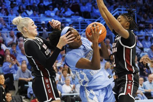 No. 1 South Carolina rallies from 11 down to beat No. 24 UNC 65-58 in ACC/SEC Challenge