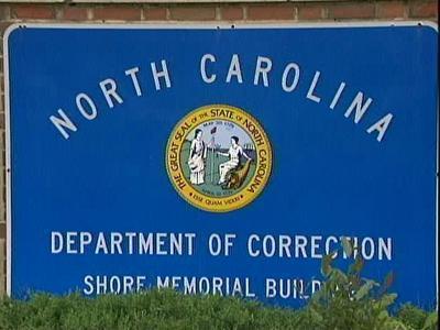 Nearly 1,000 positions cut from state corrections