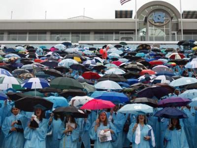Thousands get college diplomas, despite weather