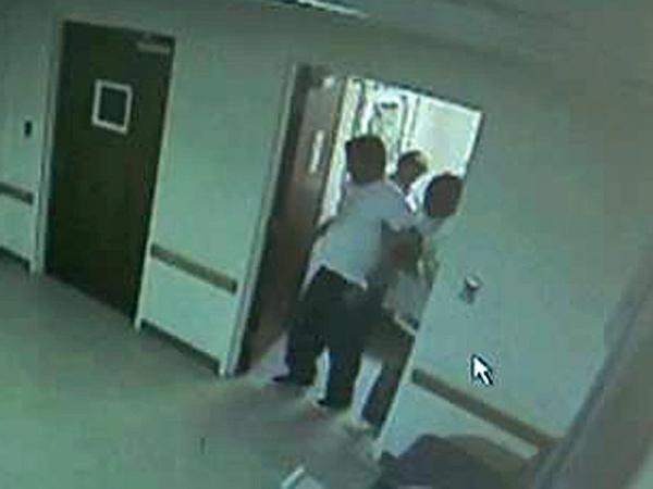 Surveillance video: Staff remove Sabock from day room; he leaves on a stretcher