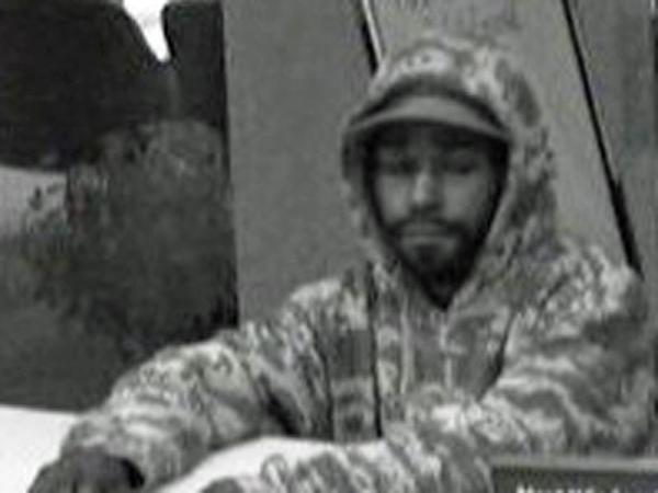 Surveillance photos from SunTrust Bank show the suspect in a Dec. 15 robbery.