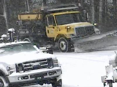Road crews battle snow