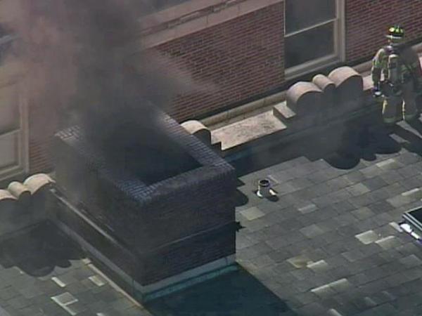 Sky 5 footage smoke from downtown Raleigh building