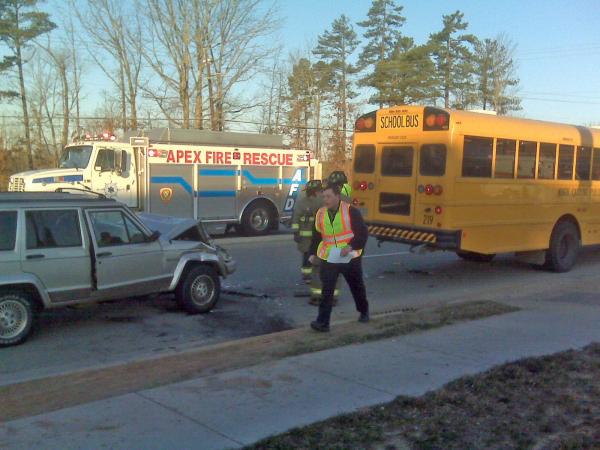 One injured in Jeep, school bus crash in Apex