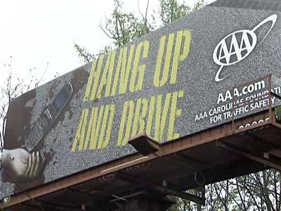 Graphic billboards warn against cell phones and driving