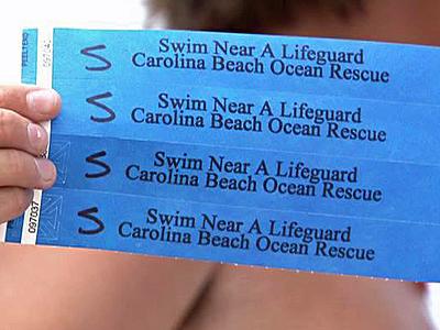Colored wristbands to find lost kids at beach