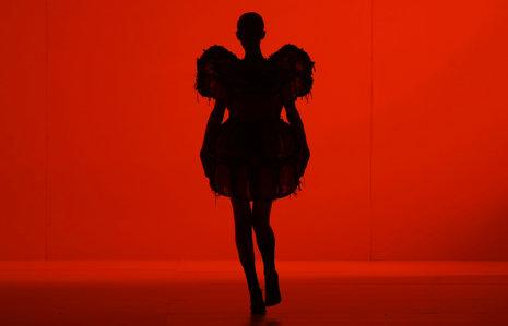 THURSDAY: A model wears a creation by Alexandre Herchcovitch during the Sao Paulo Fashion Week in Sao Paulo. (AP Photo/Nelson Antoine)