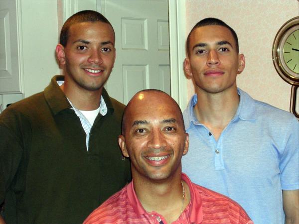 Dan Bowens, on the right, poses for a photo with his brother, Ben, and stepdad Byron Pitts.