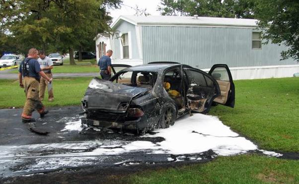 Police: Woman set fire to car during repossession