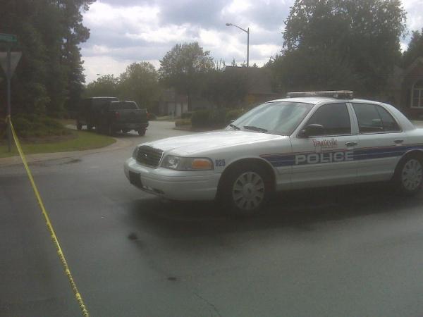 A police car blocked off the corner of Dartmouth and Briarcreek Place Friday afternoon in Fayetteville.